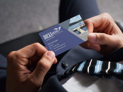 mockup-of-a-man-holding-a-business-card-with-an-embossed-texture-33770